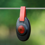 patriot fence alert light on fence wire and green background