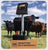 Gallagher MB150 electric fence Charger rated at 30 Miles or 100 Acres without 110V AC with Adapter with black cows in field on a farm